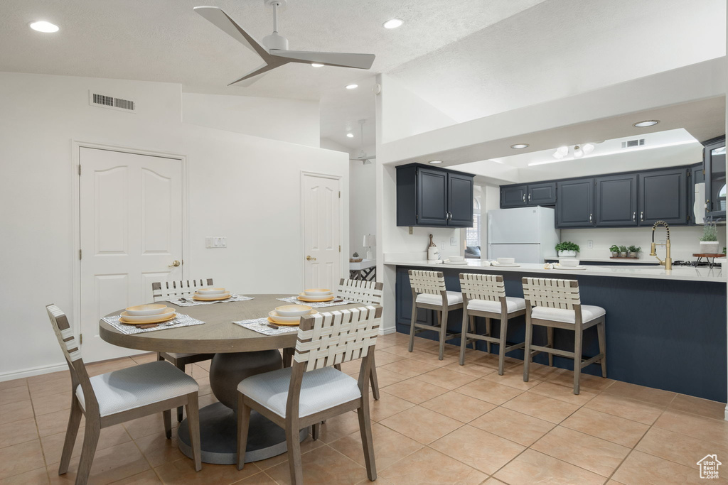 Dining space with recessed lighting, ceiling fan, visible vents, and light tile patterned floors