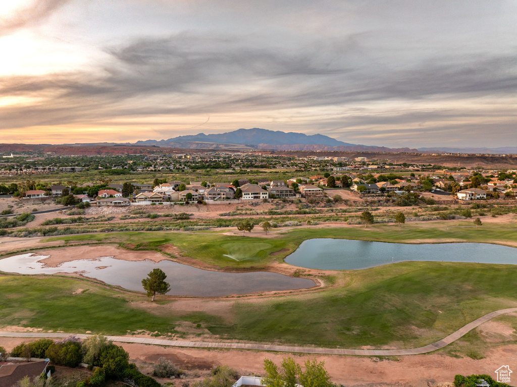 Surrounding community with a residential view, golf course view, and a water and mountain view