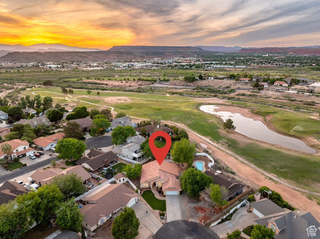 Drone / aerial view with a mountain view, golf course view, and a residential view