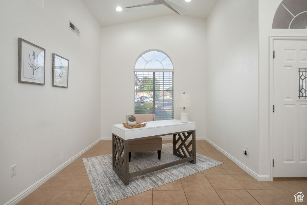 Home office featuring baseboards, visible vents, and light tile patterned floors