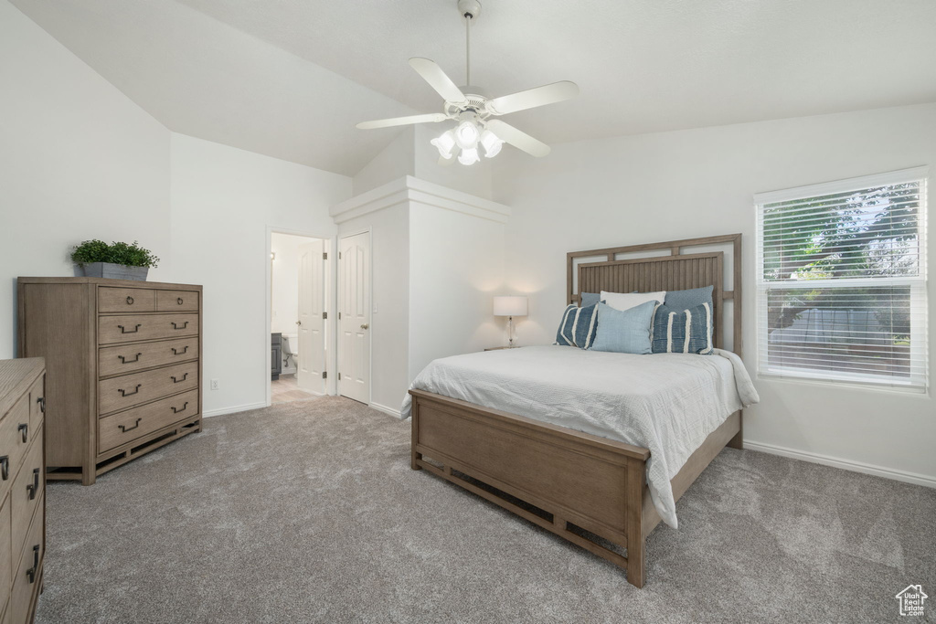 Bedroom with baseboards, ceiling fan, carpet, and vaulted ceiling