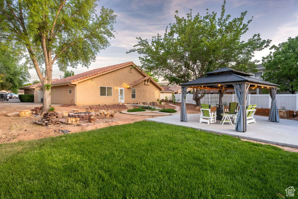 View of yard with a gazebo, a patio area, and fence