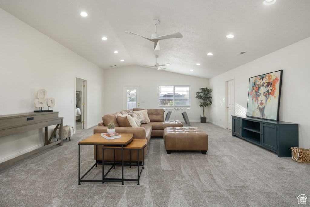 Living area featuring light carpet, vaulted ceiling, recessed lighting, and visible vents