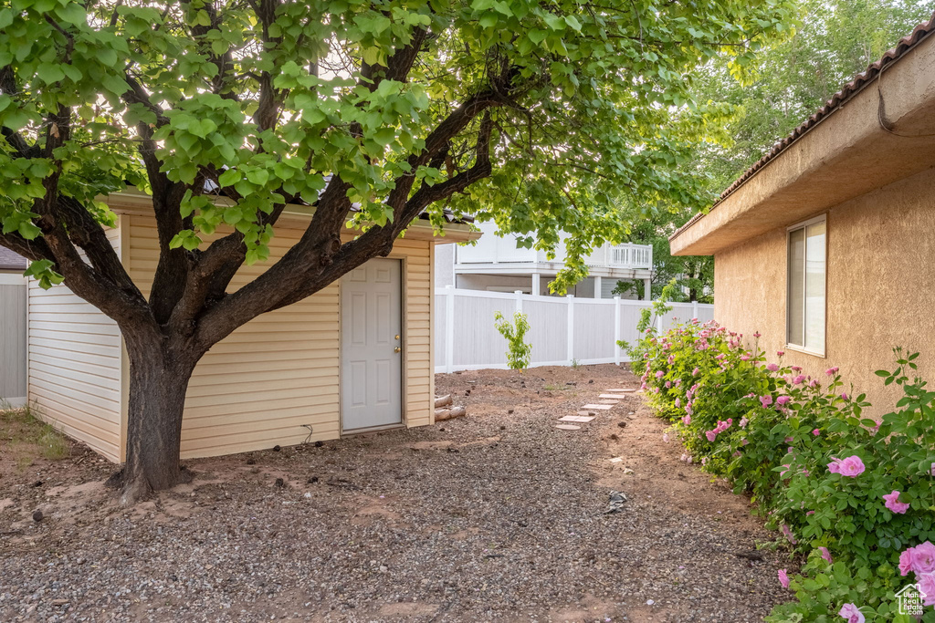 View of yard featuring fence