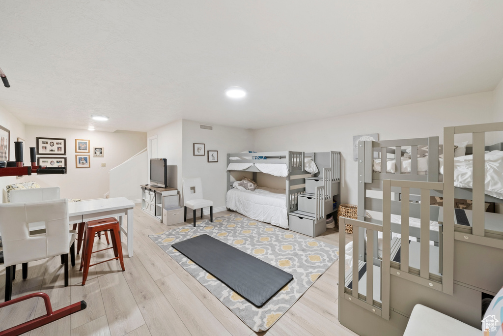 Interior space featuring visible vents, recessed lighting, and wood finished floors
