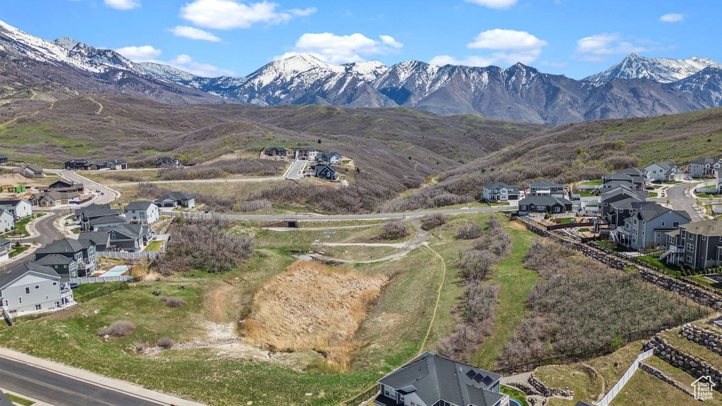 Property view of mountains with a residential view