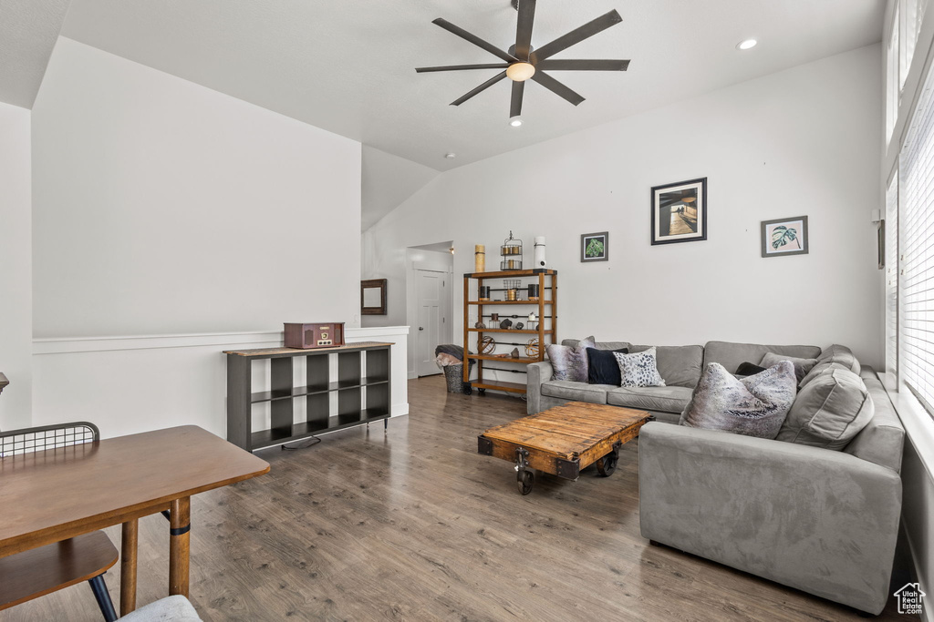 Living area featuring vaulted ceiling, a ceiling fan, recessed lighting, and wood finished floors