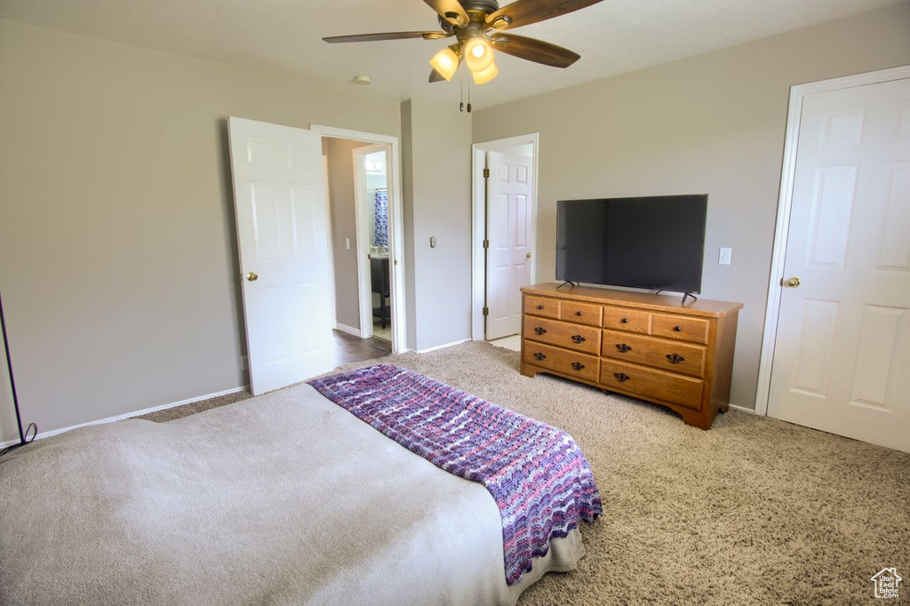 Bedroom featuring baseboards, ceiling fan, and carpet