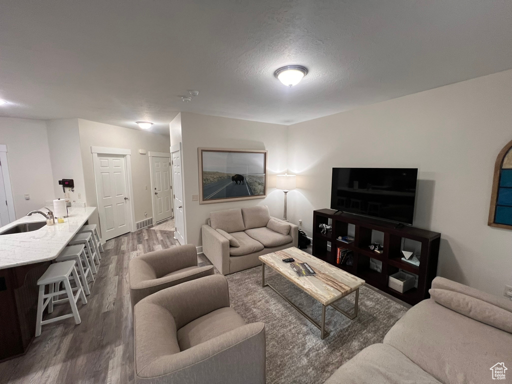 Living room with baseboards and wood finished floors