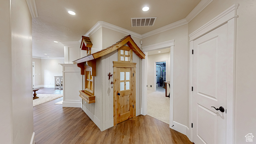 Corridor featuring visible vents, recessed lighting, and wood finished floors