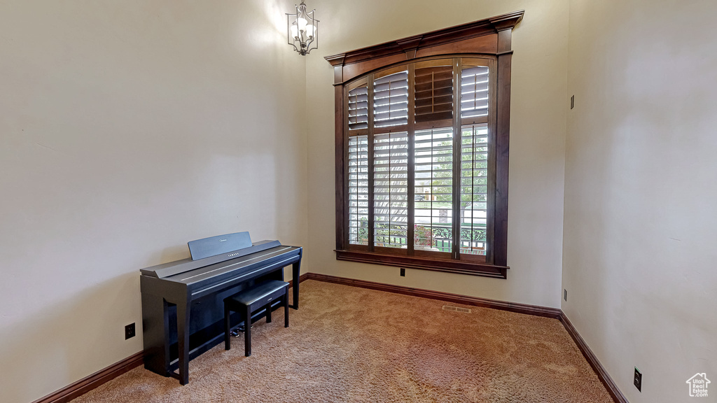 Home office with carpet floors and baseboards