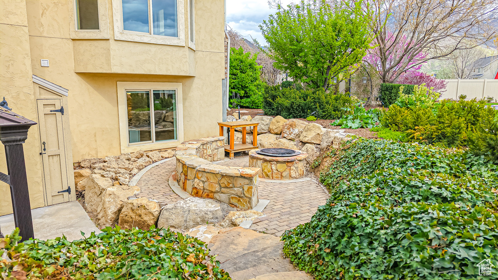 View of yard with an outdoor fire pit