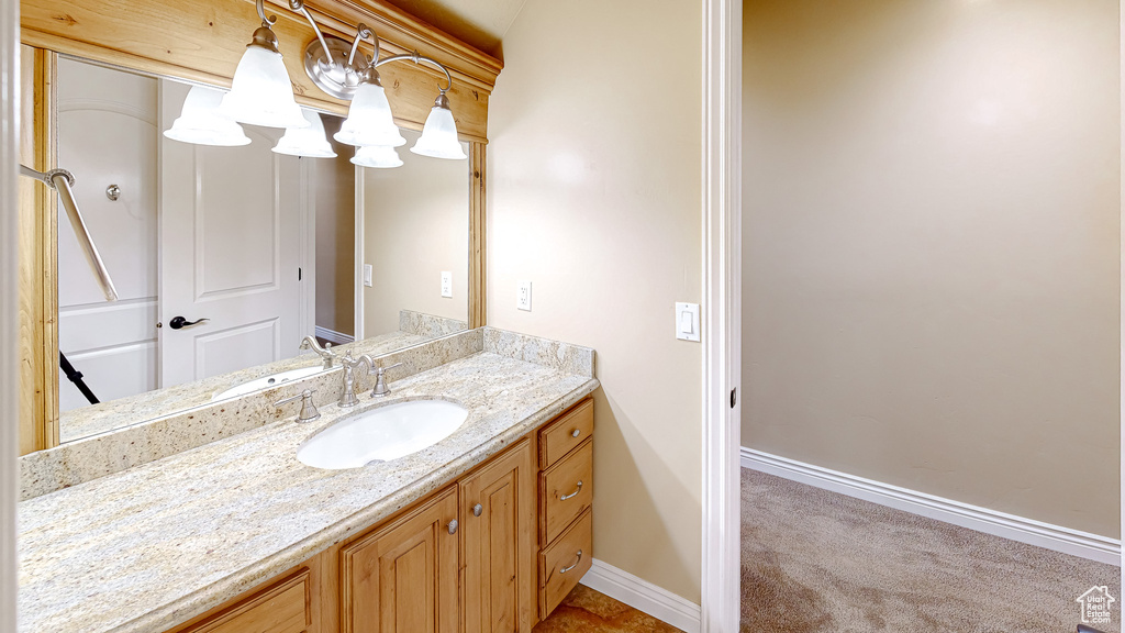 Bathroom featuring baseboards and vanity