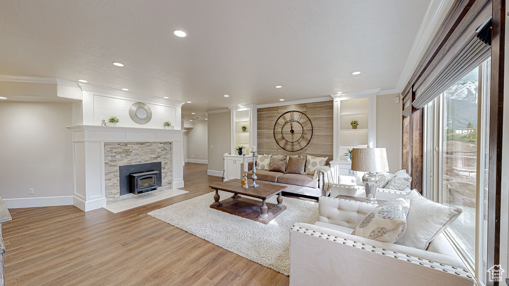Living area with recessed lighting, baseboards, and wood finished floors