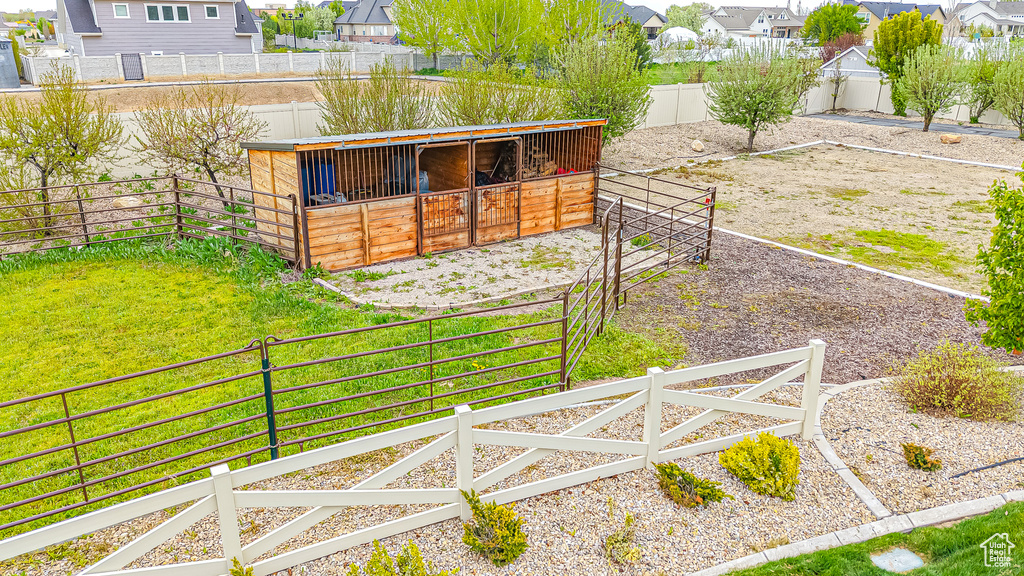 View of yard with an exterior structure, an outbuilding, and a residential view