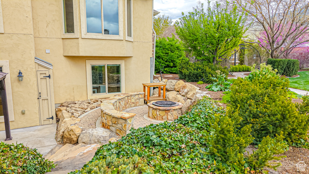 View of patio featuring an outdoor fire pit