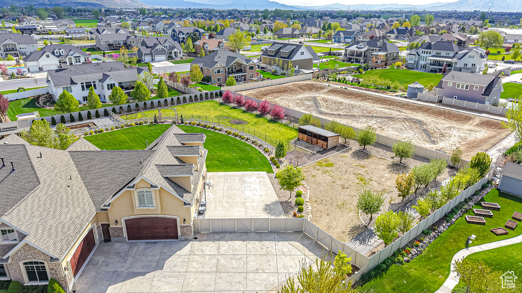 Birds eye view of property with a mountain view and a residential view