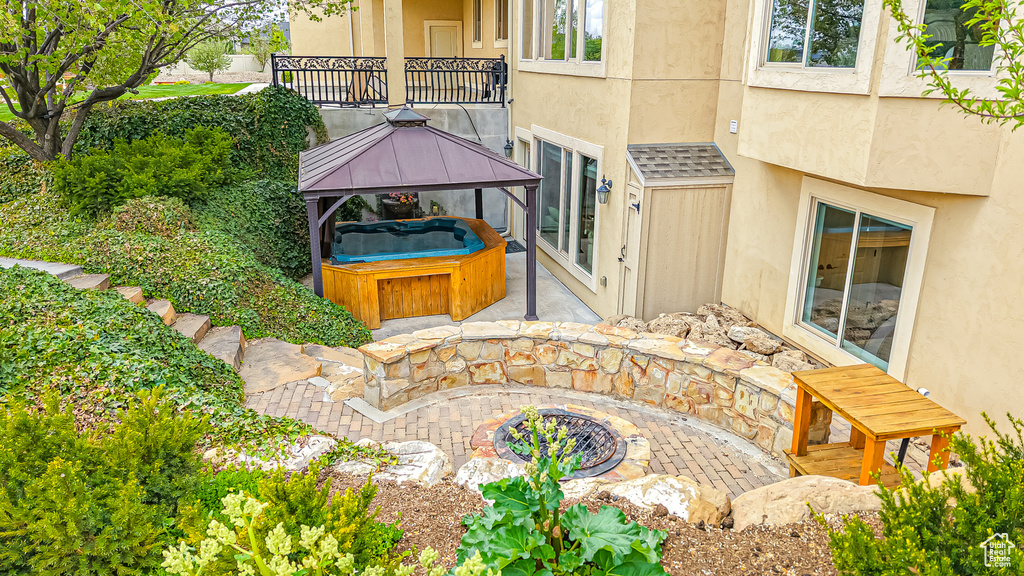 Exterior space featuring a jacuzzi