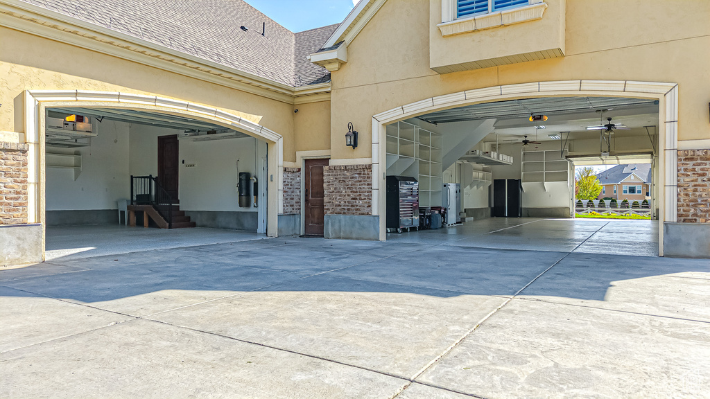 Garage featuring driveway