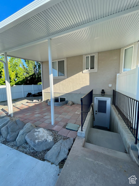 View of patio with fence