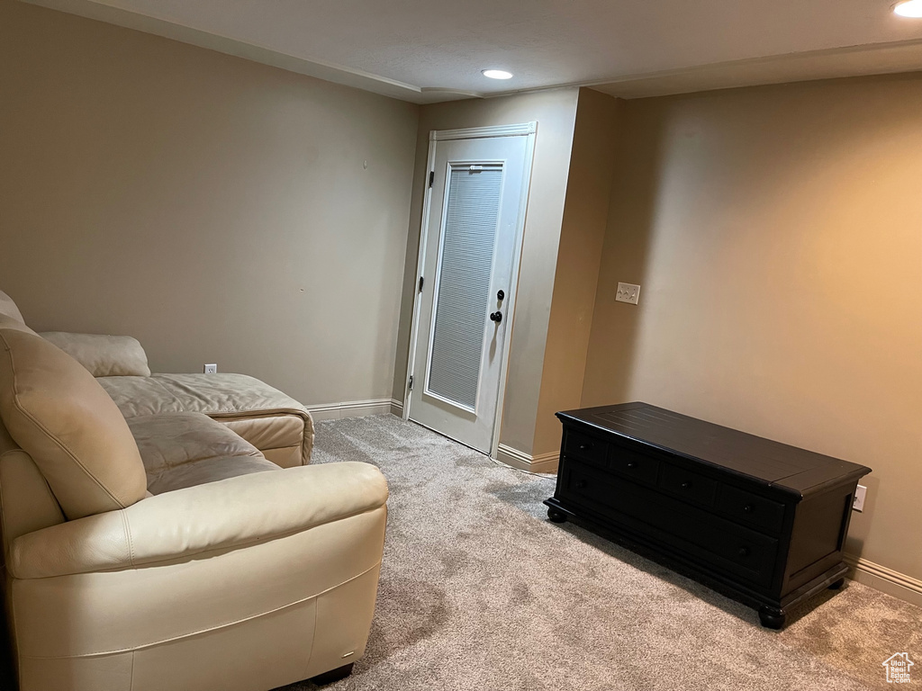 Sitting room featuring baseboards, carpet flooring, and recessed lighting