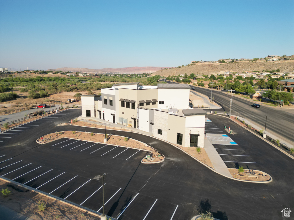 Birds eye view of property with a mountain view