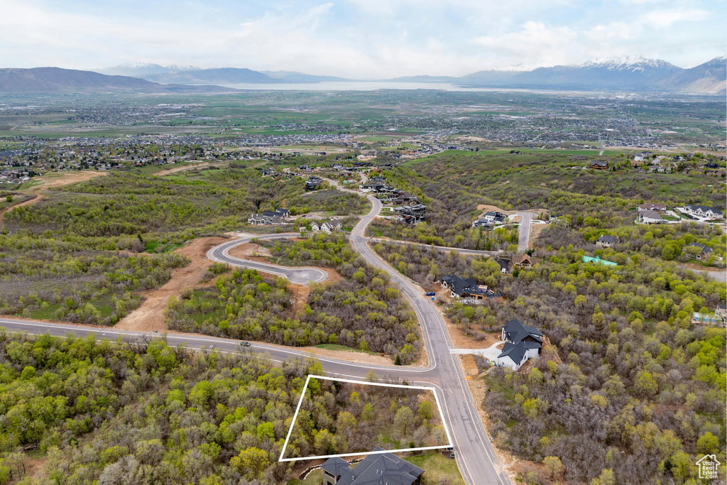 Birds eye view of property with a mountain view