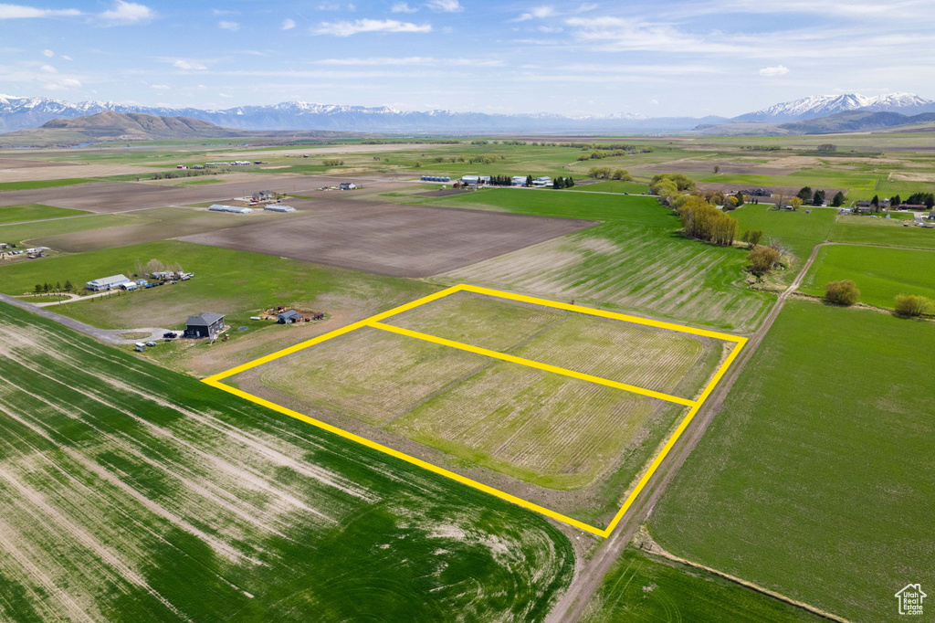 Birds eye view of property with a mountain view and a rural view