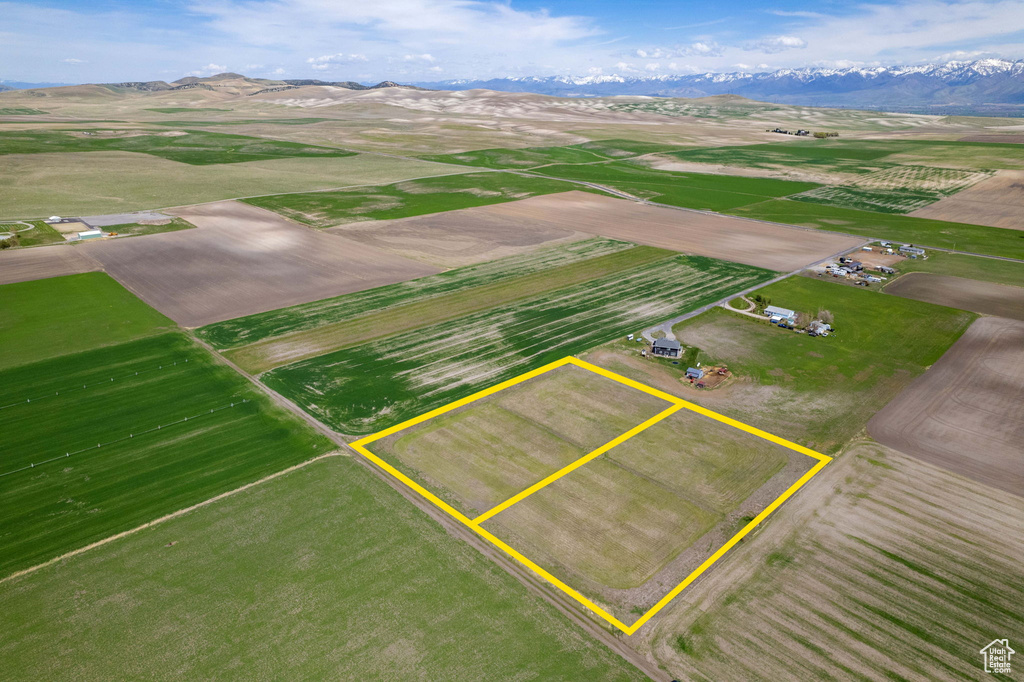 Drone / aerial view with a mountain view and a rural view