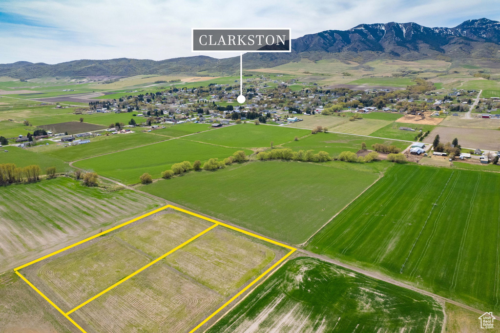 Birds eye view of property with a rural view and a mountain view