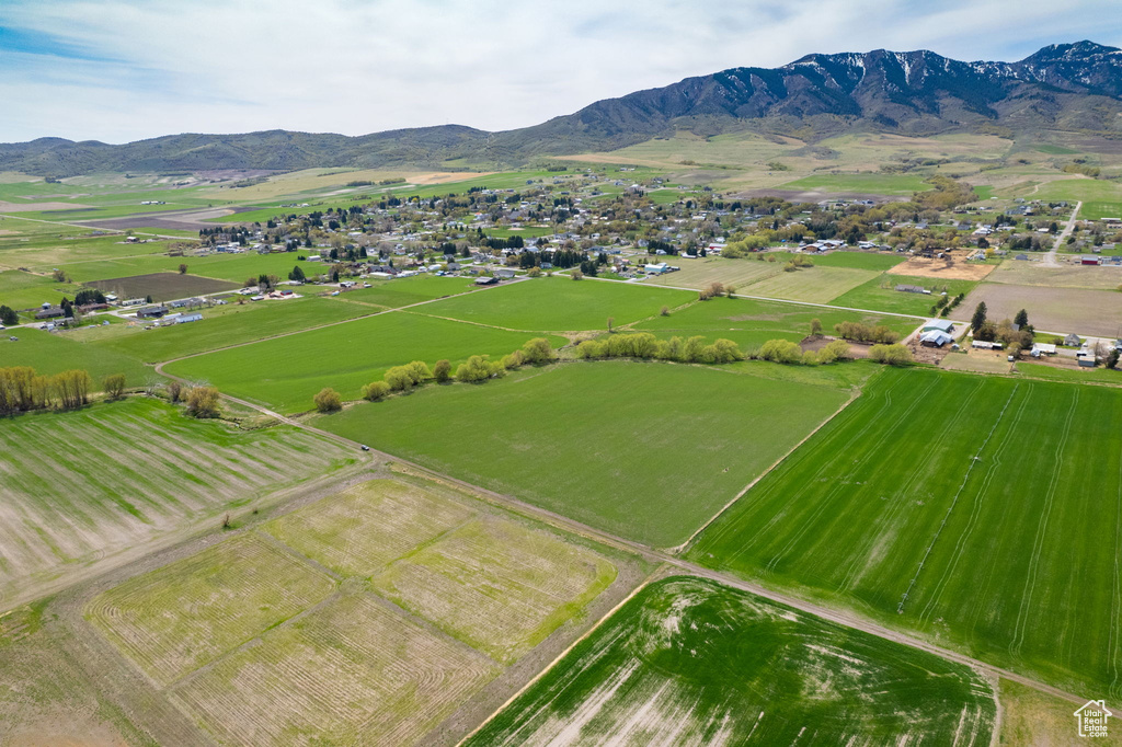 Birds eye view of property with a rural view and a mountain view