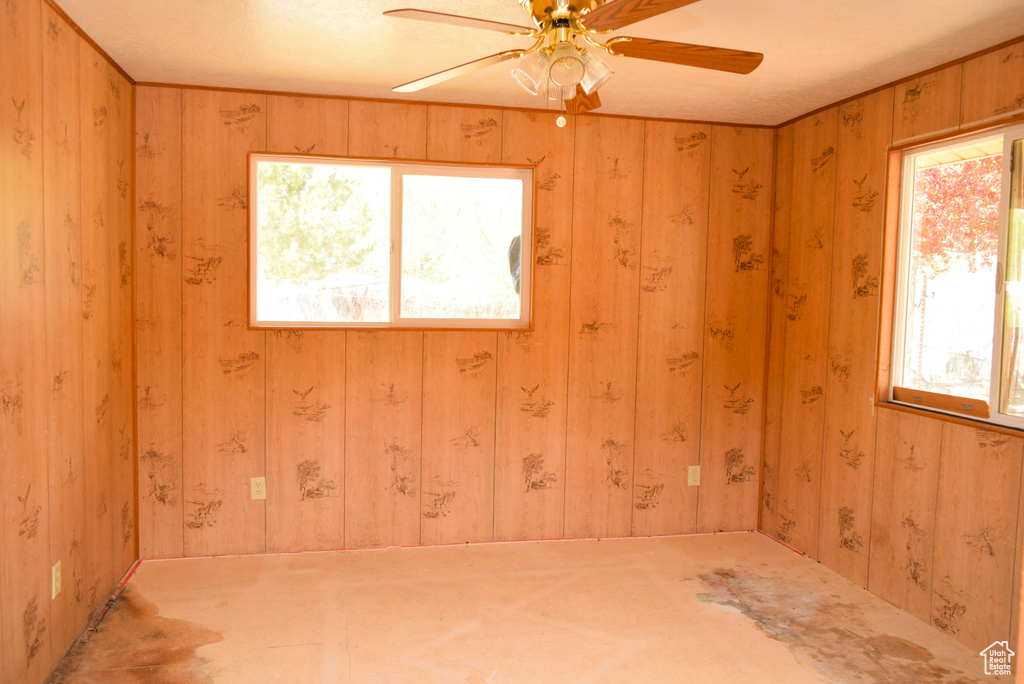Empty room featuring a ceiling fan