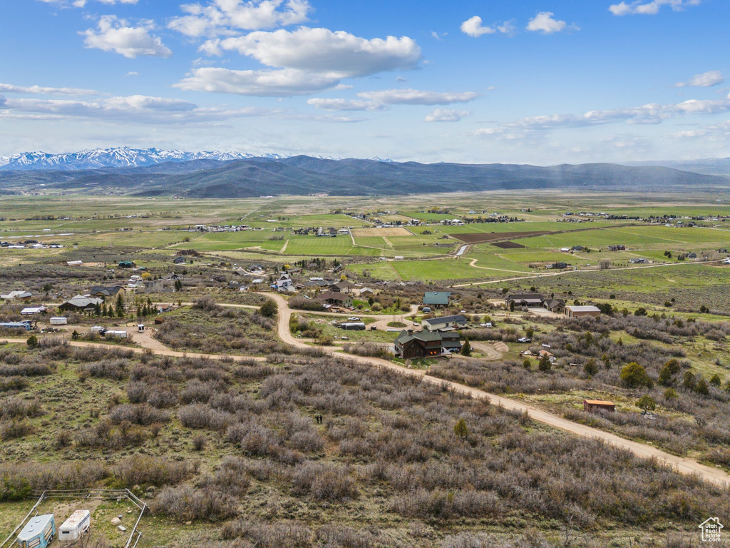 Birds eye view of property with a rural view and a mountain view