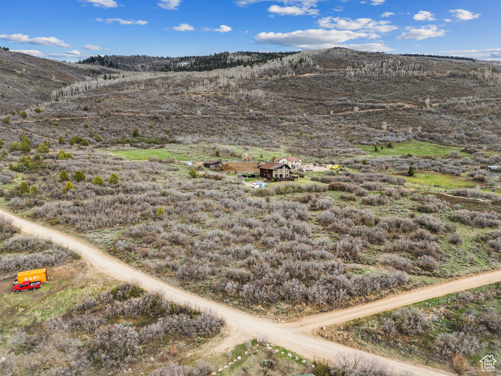 Birds eye view of property with a mountain view