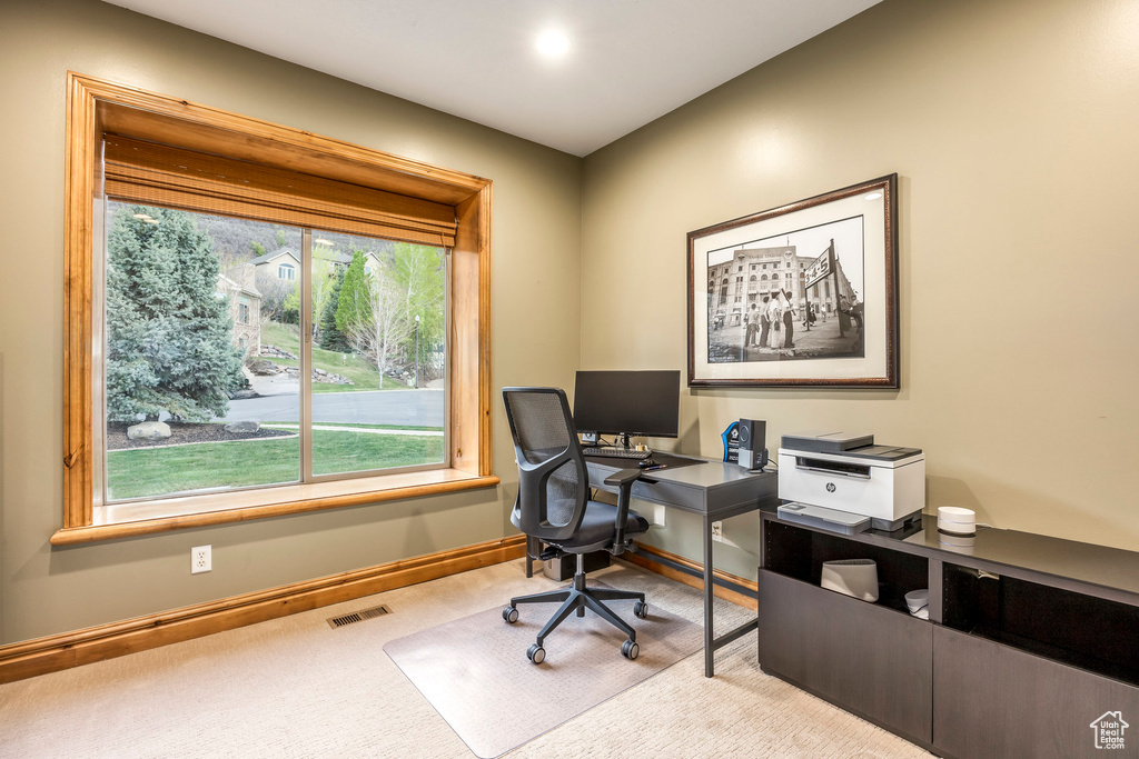 Carpeted office featuring baseboards and visible vents