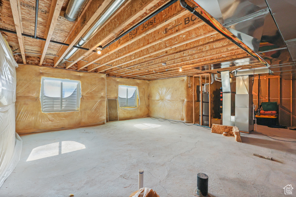 Below grade area featuring water heater