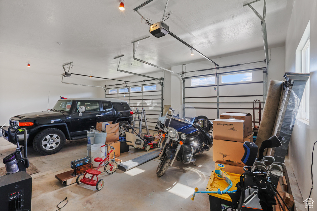 Garage featuring a garage door opener