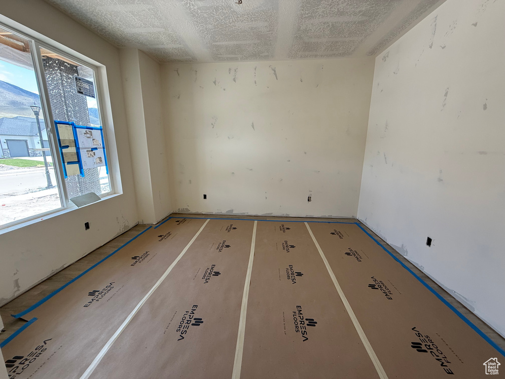 Spare room with a textured ceiling