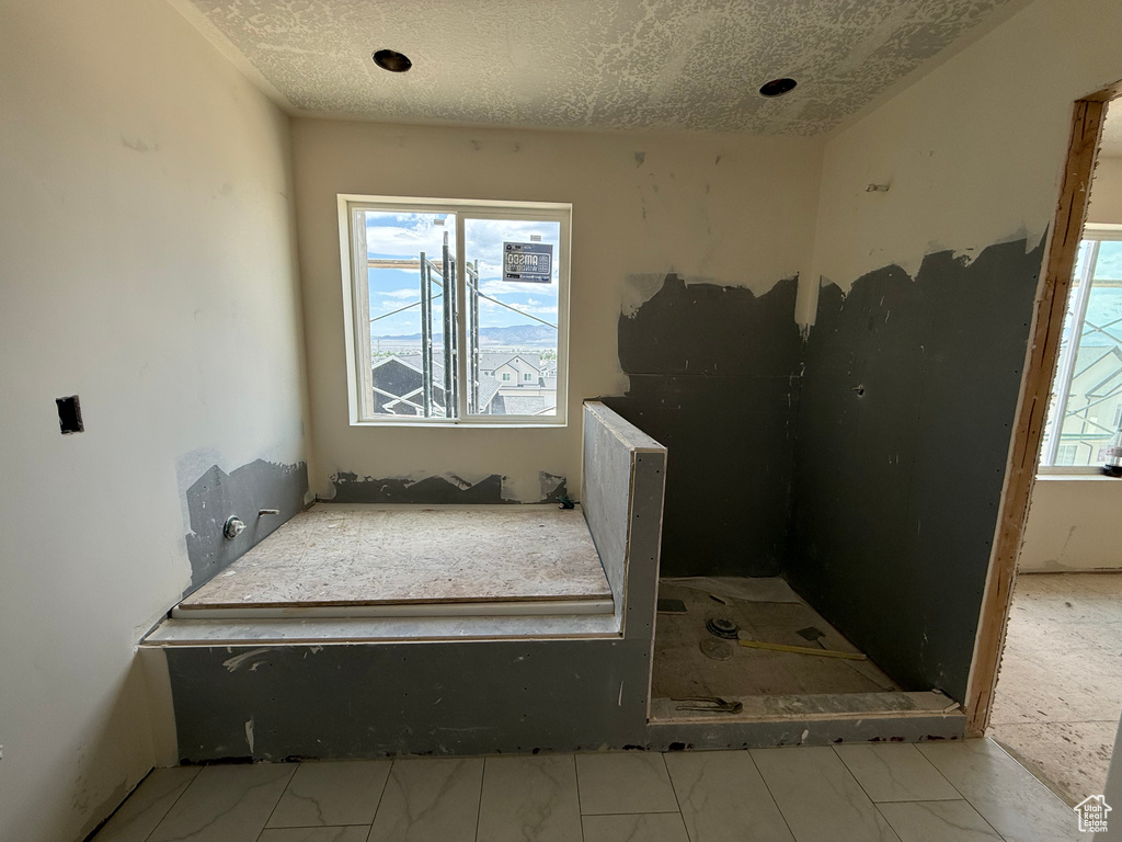 Bathroom with a textured ceiling