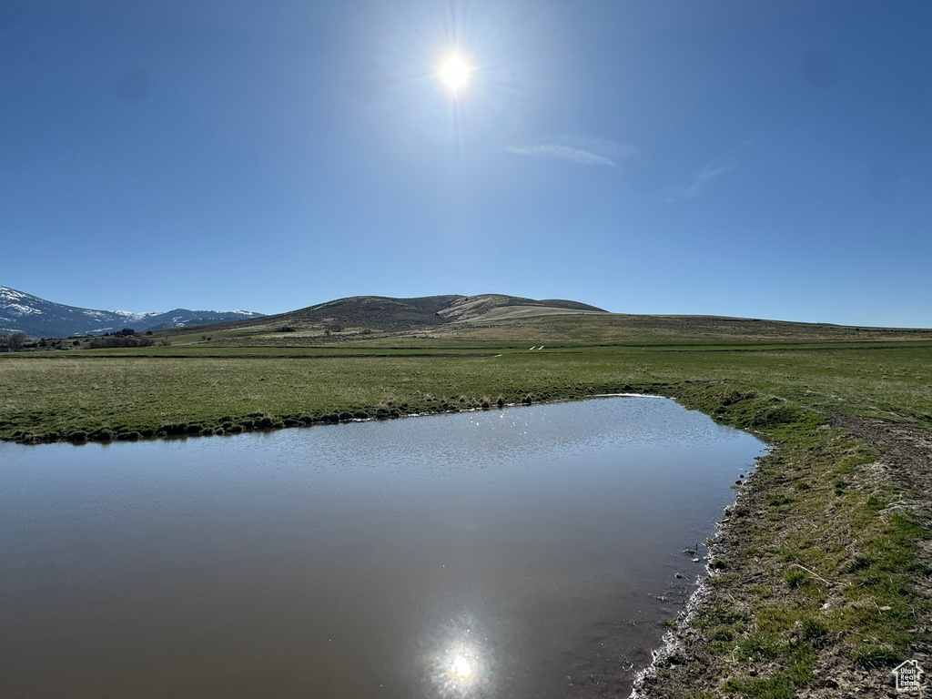 View of water feature with a mountain view