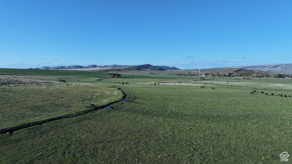 View of mountain background featuring rural landscape