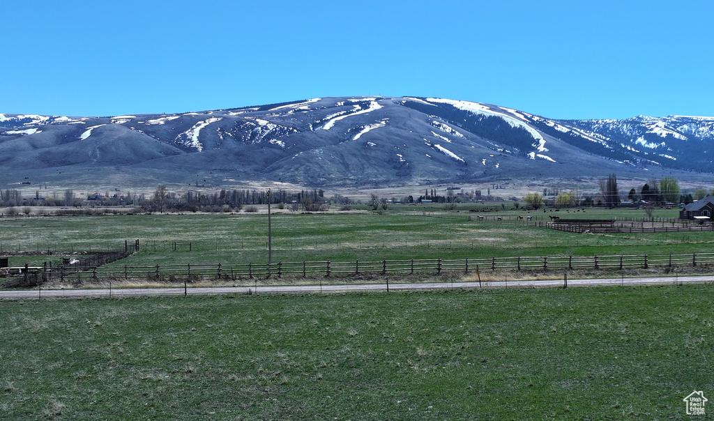 Property view of mountains with a rural view