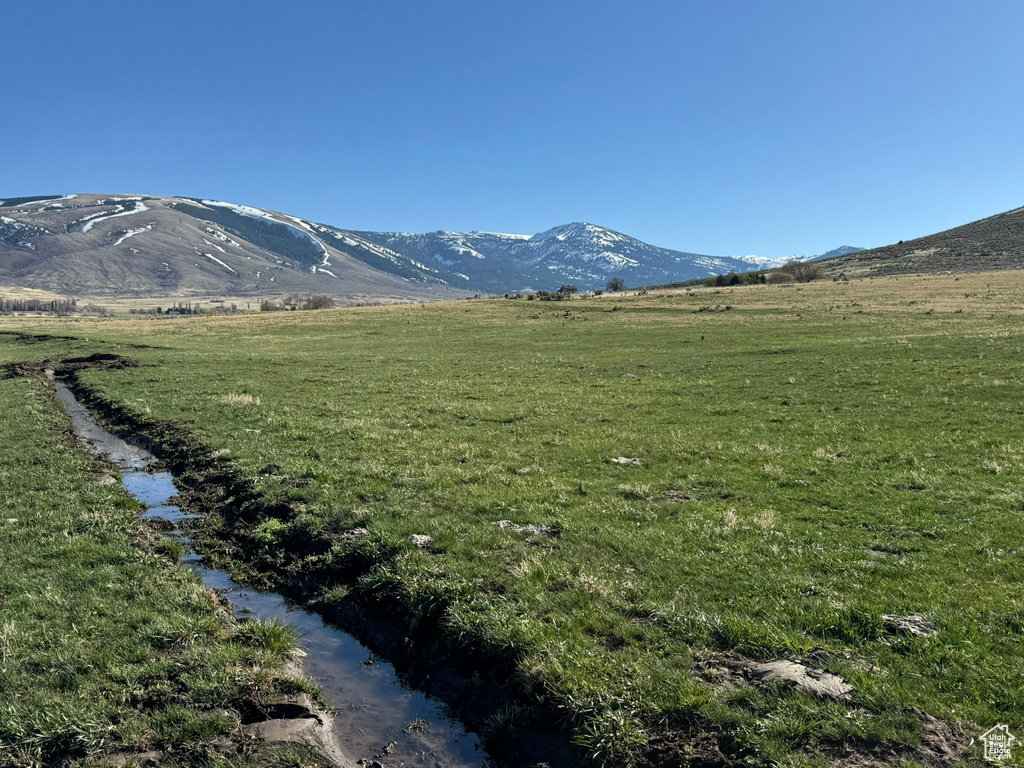 Property view of mountains with a rural view
