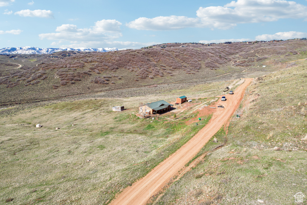 Birds eye view of property featuring a mountain view and a rural view
