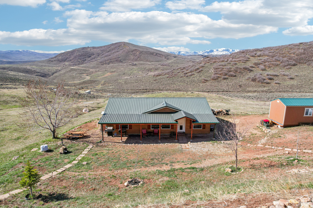 Exterior space featuring a mountain view