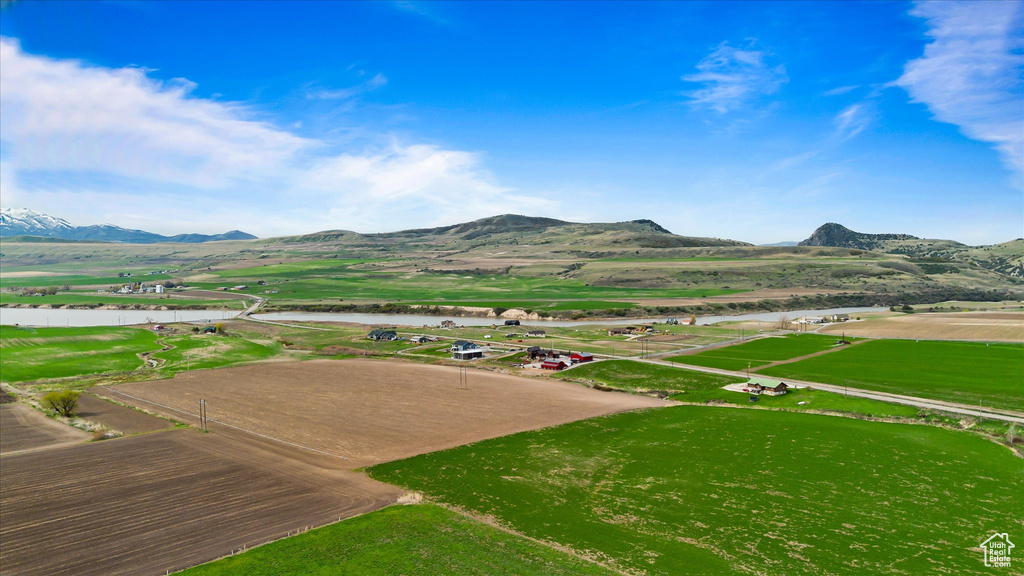 View of mountain feature featuring a water view and a rural view