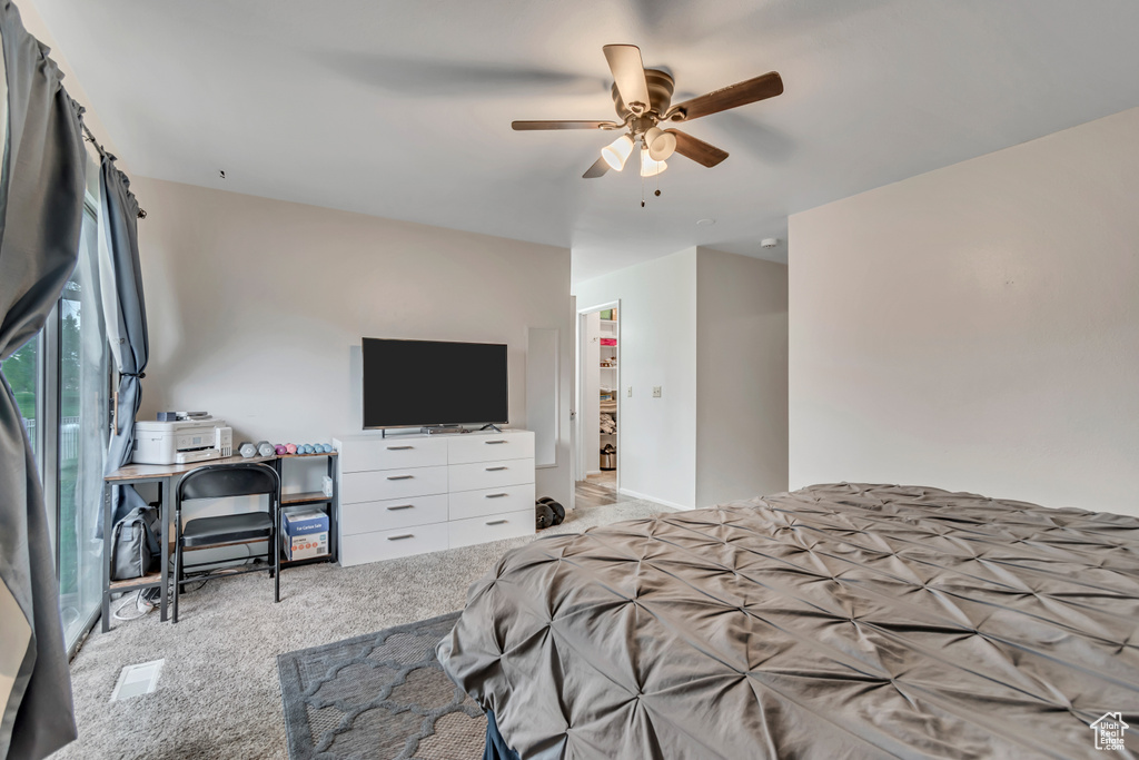 Bedroom with carpet flooring and a ceiling fan