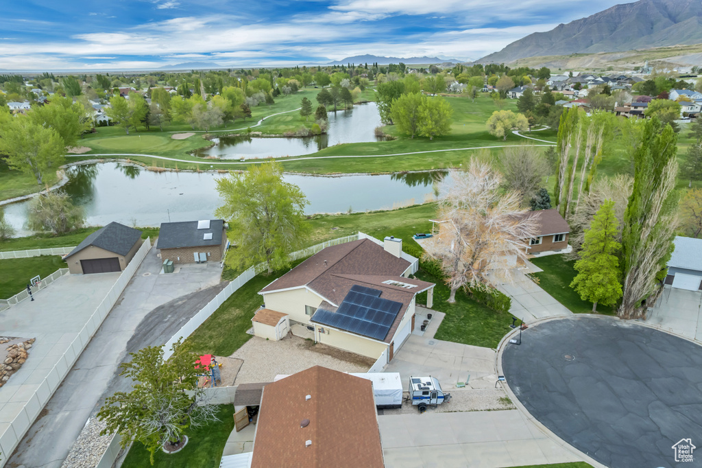Drone / aerial view featuring a residential view, golf course view, and a water and mountain view