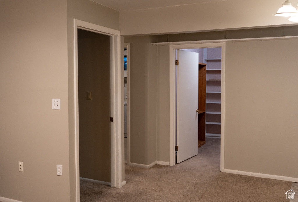 Corridor with carpet floors and baseboards