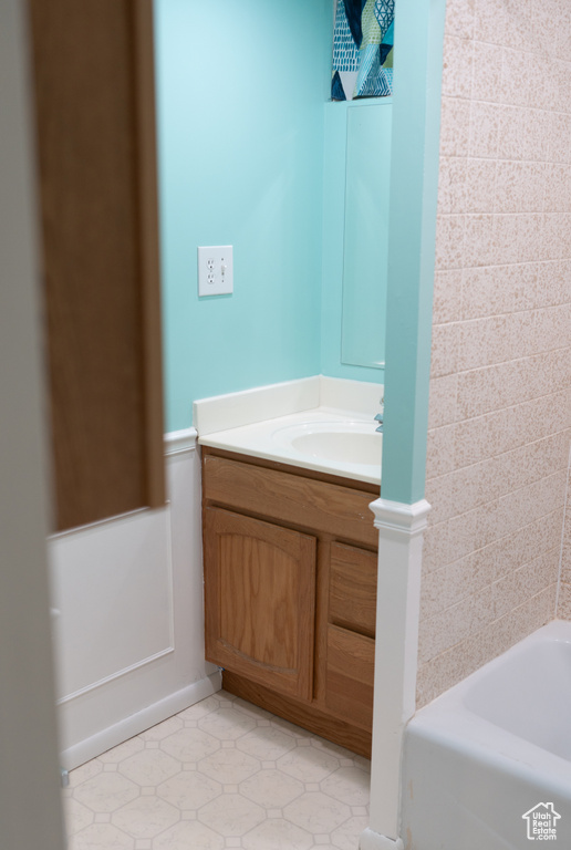Bathroom with vanity and tile patterned flooring